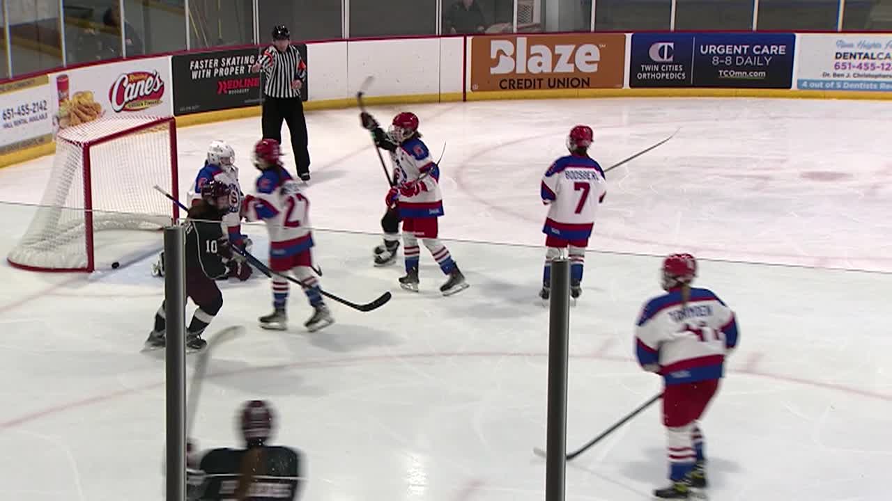 Hockey players playing hockey on ice