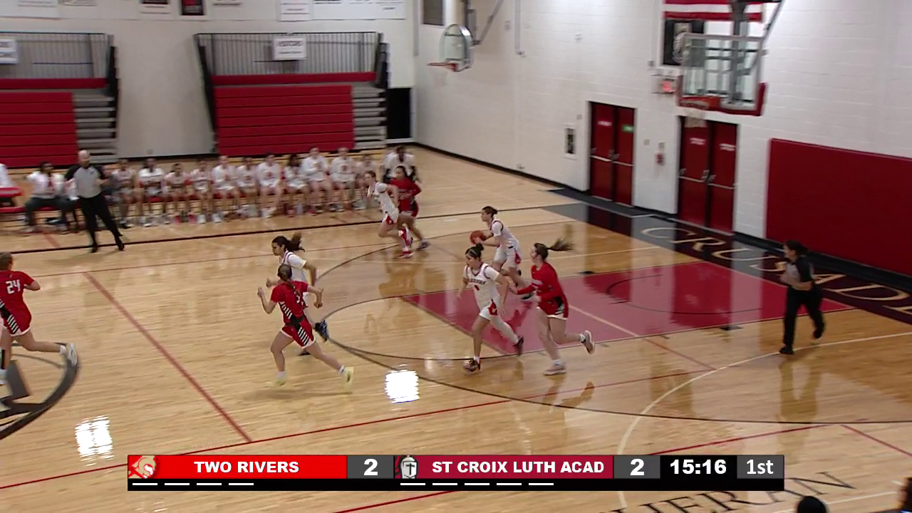 basketball players running towards basket from far end of the court