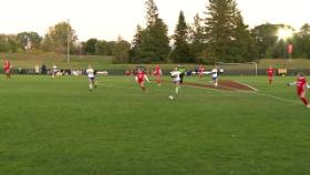 girls playing soccer on a soccer field