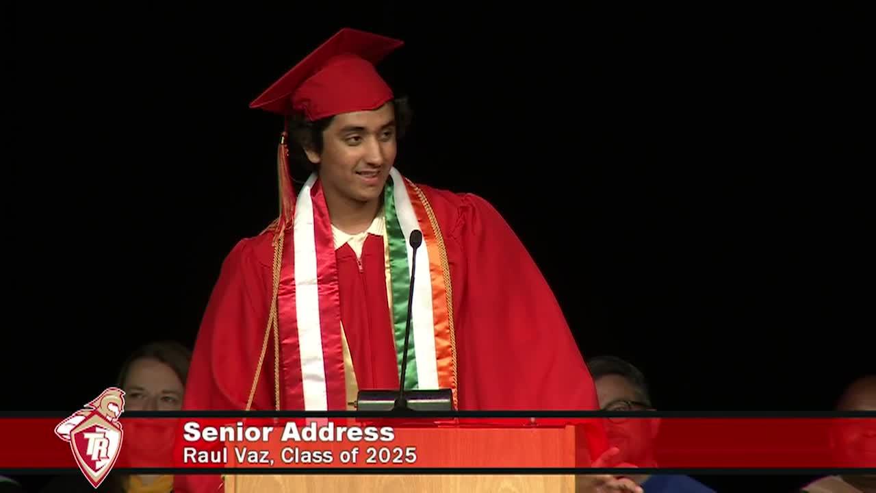 graduate speaking at the podium