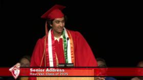 graduate speaking at the podium