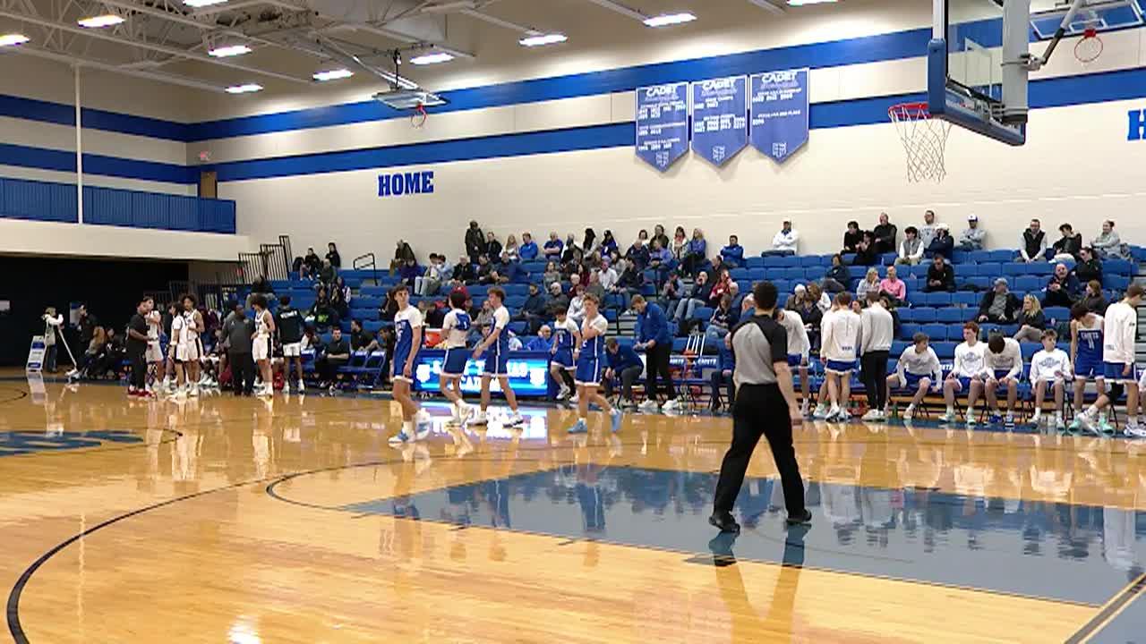 basektball players playing basketball on a basketball court