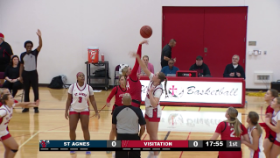 basketball players jumping for the ball during tipoff