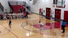 volleyball player serving ball