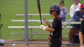 softball player getting ready to bat