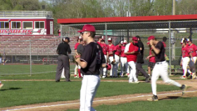 baseball players running out to the field after before the next inning