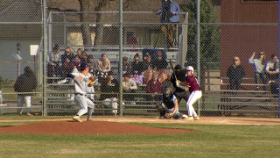pitcher throwing a pitch to a batter