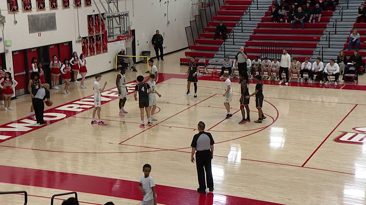 basketball players waiting for play to start again