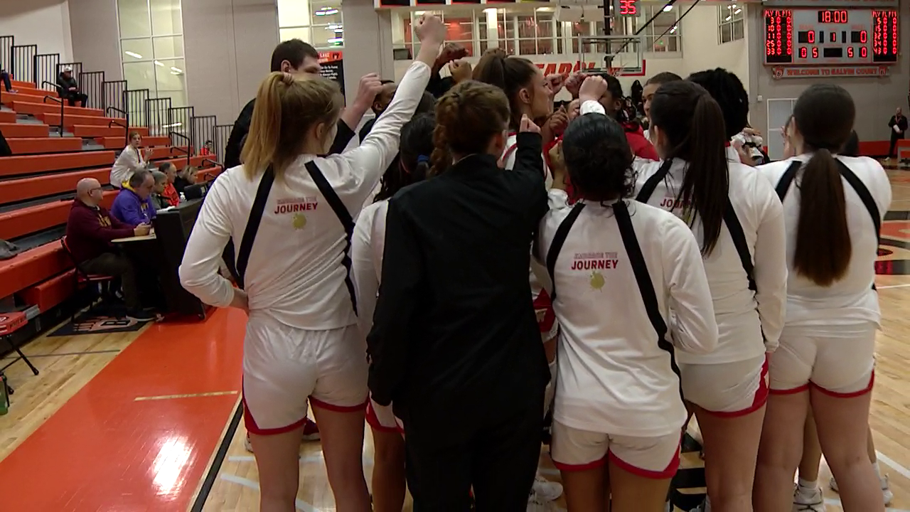 basketball players in a group before the game starts