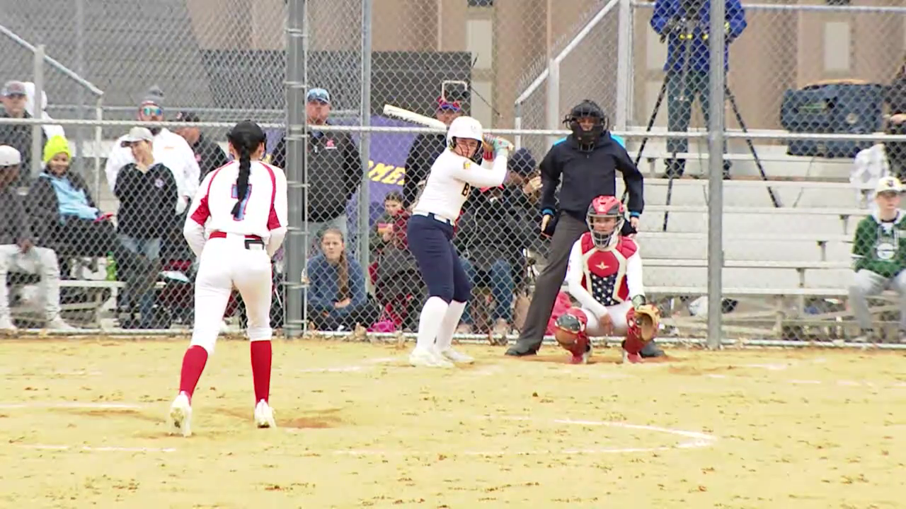 softball player pitching