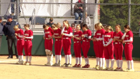 softball players lined up before the game starts