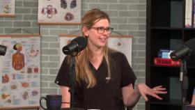 A woman in front of a microphone