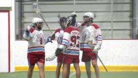 group of lacrosse players talking between plays